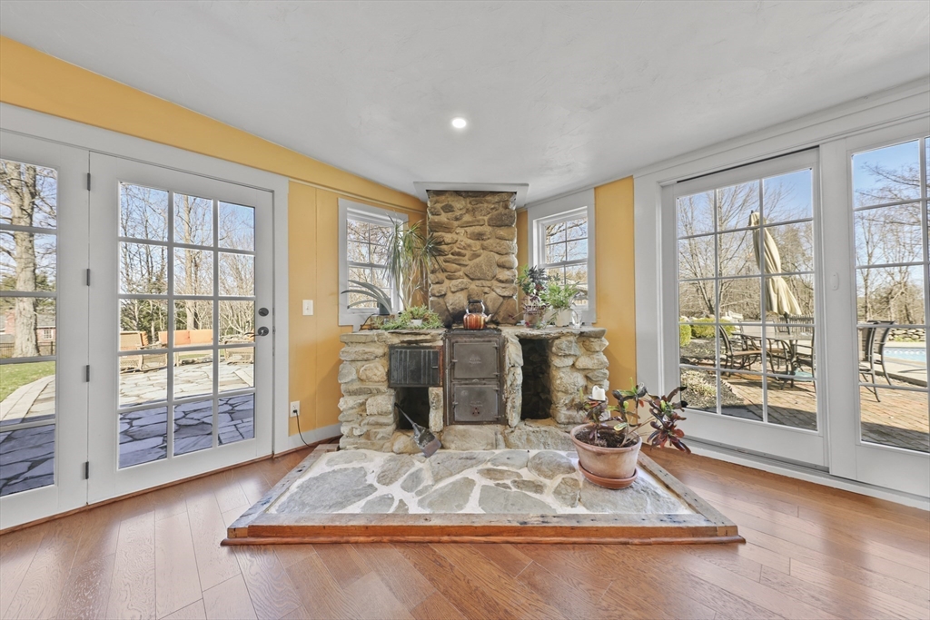 71 Prindle Hill Road Charlton, MA 01507 - Photo 11 of 40 a room with wooden floor and large windows
