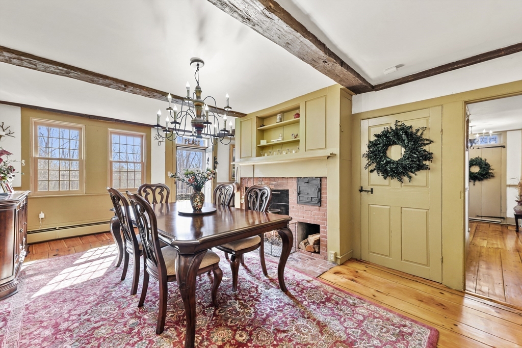 71 Prindle Hill Road Charlton, MA 01507 - Photo 14 of 40 a dining room with furniture a chandelier and wooden floor