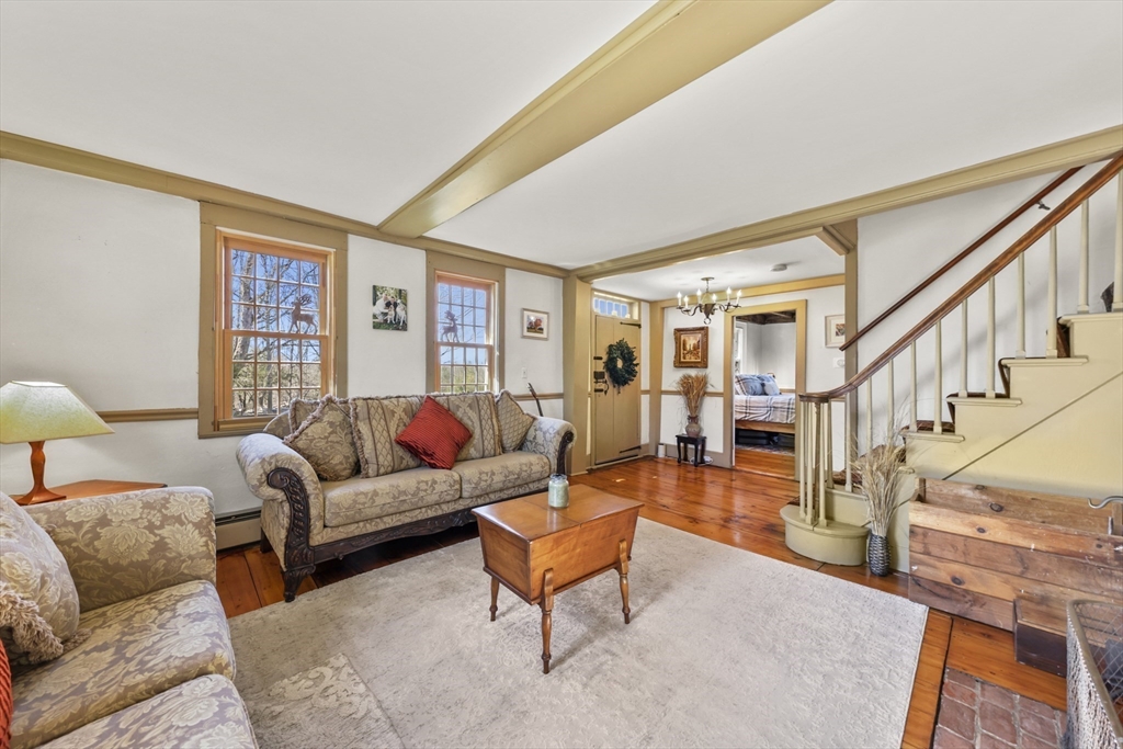 71 Prindle Hill Road Charlton, MA 01507 - Photo 16 of 40 a living room with furniture and a fireplace