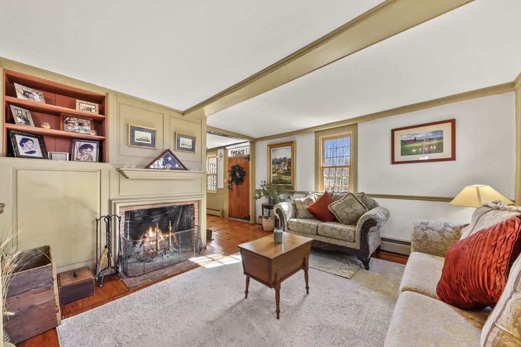 71 Prindle Hill Road Charlton, MA 01507 - Photo 17 of 40 a living room with furniture and a fireplace