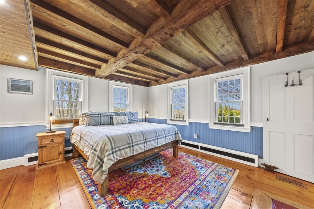 71 Prindle Hill Road Charlton, MA 01507 - Photo 18 of 40 a bed room with a bed and a couch