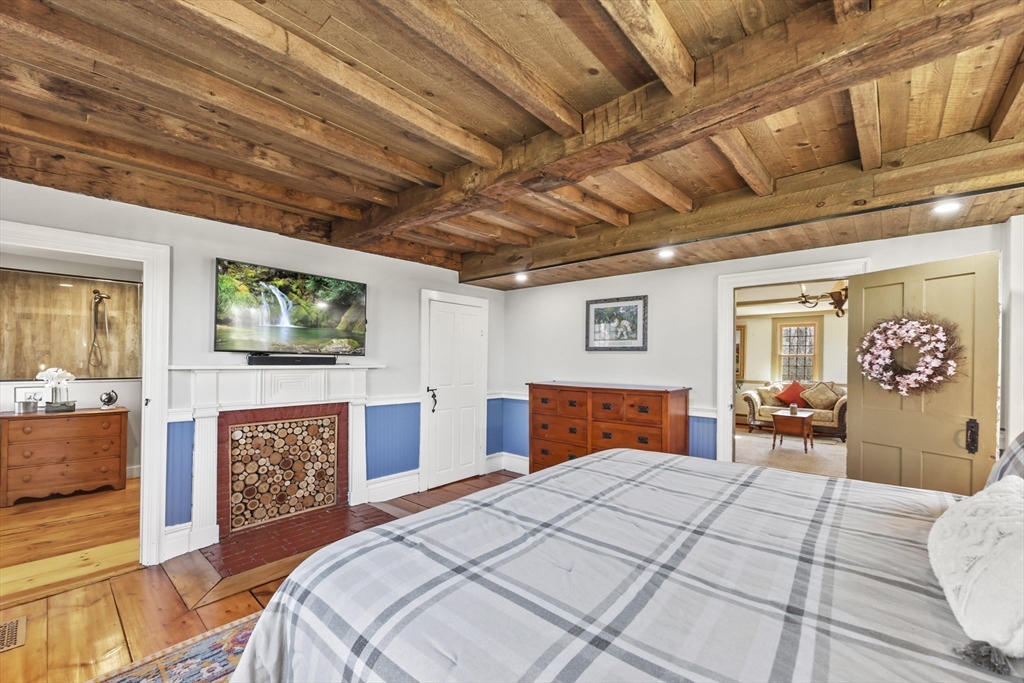 71 Prindle Hill Road Charlton, MA 01507 - Photo 19 of 40 a bedroom with furniture wooden floor and window