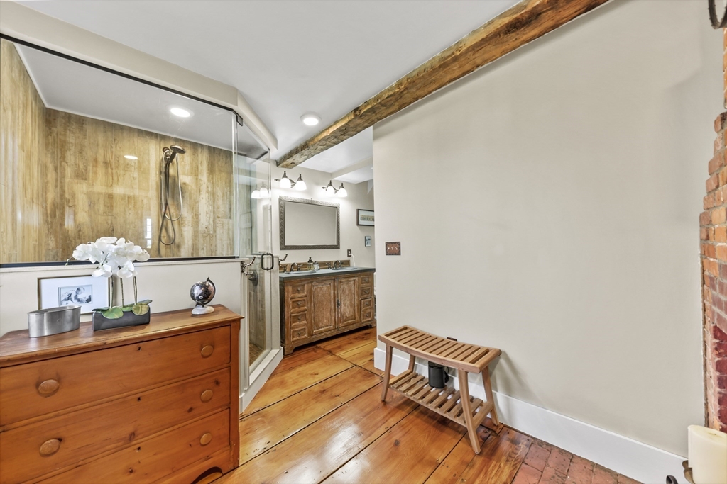 71 Prindle Hill Road Charlton, MA 01507 - Photo 20 of 40 a kitchen with wooden floor and cabinets