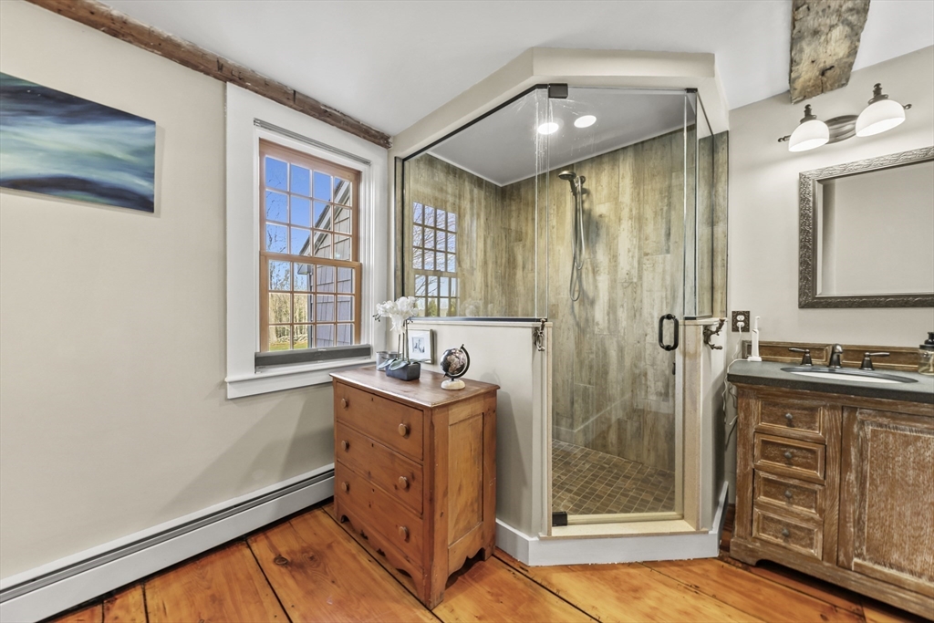 71 Prindle Hill Road Charlton, MA 01507 - Photo 21 of 40 a bathroom with a sink a mirror and a shower