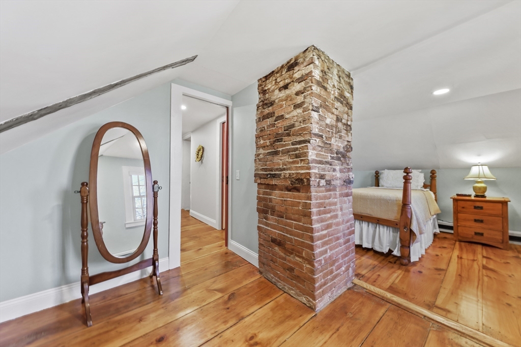 71 Prindle Hill Road Charlton, MA 01507 - Photo 29 of 40 a view of an empty room with furniture and wooden floor