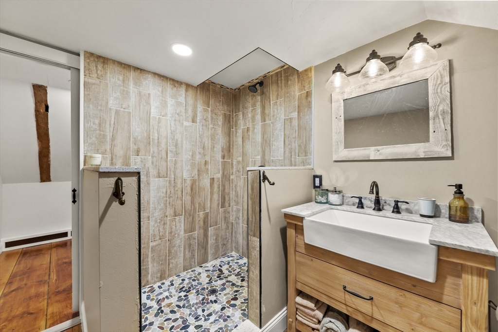 71 Prindle Hill Road Charlton, MA 01507 - Photo 30 of 40 a bathroom with a sink vanity and a mirror