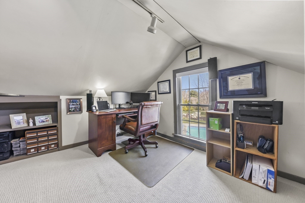 71 Prindle Hill Road Charlton, MA 01507 - Photo 32 of 40 a view of a workspace with furniture and a bookshelf