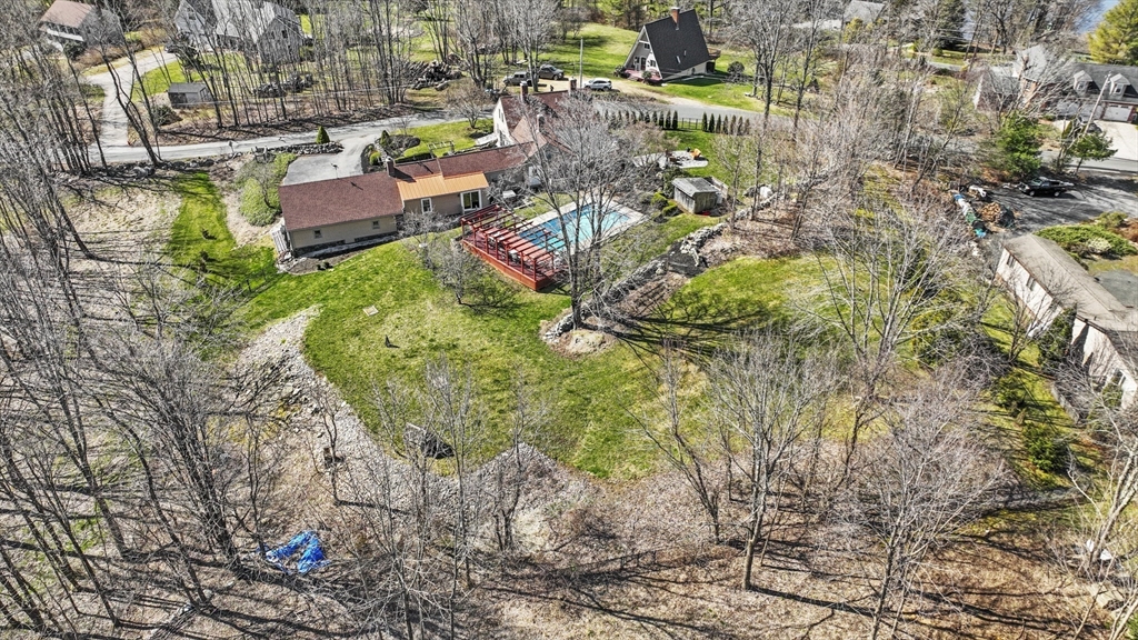 71 Prindle Hill Road Charlton, MA 01507 - Photo 4 of 40 a aerial view of a house with yard and sitting area