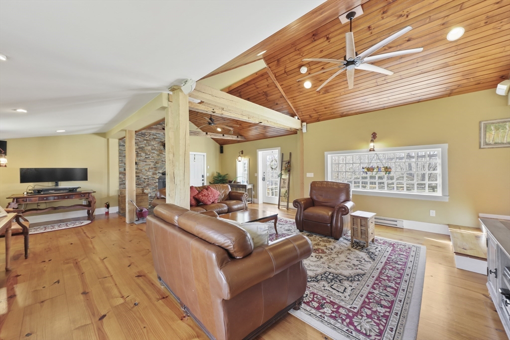 71 Prindle Hill Road Charlton, MA 01507 - Photo 7 of 40 a living room with furniture and a flat screen tv