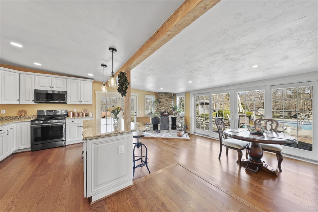 71 Prindle Hill Road Charlton, MA 01507 - Photo 8 of 40 a living room with stainless steel appliances furniture wooden floor and a view of kitchen