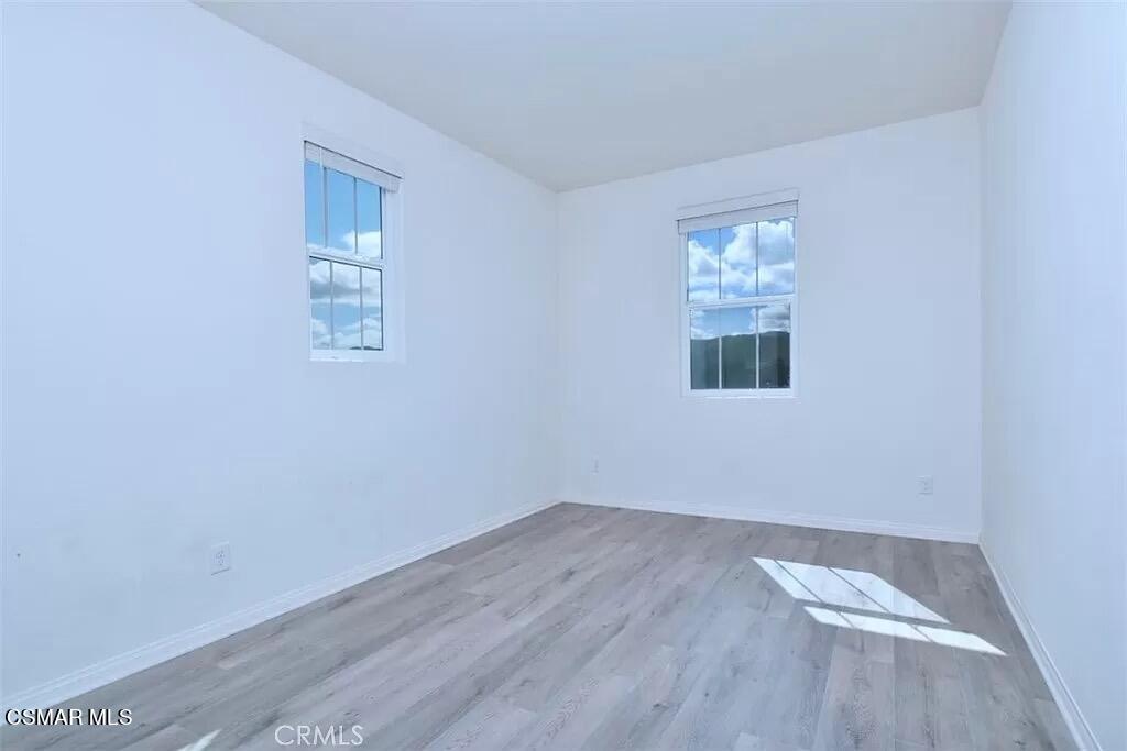 207 Morro Way, Unit 3 Simi Valley, CA 93065 - Photo 15 of 31 a view of a room with wooden floor and window