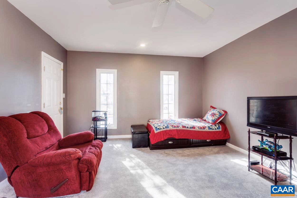 29 Stonewall Road Palmyra, VA 22963 - Photo 10 of 22 a bedroom with furniture and a flat screen tv