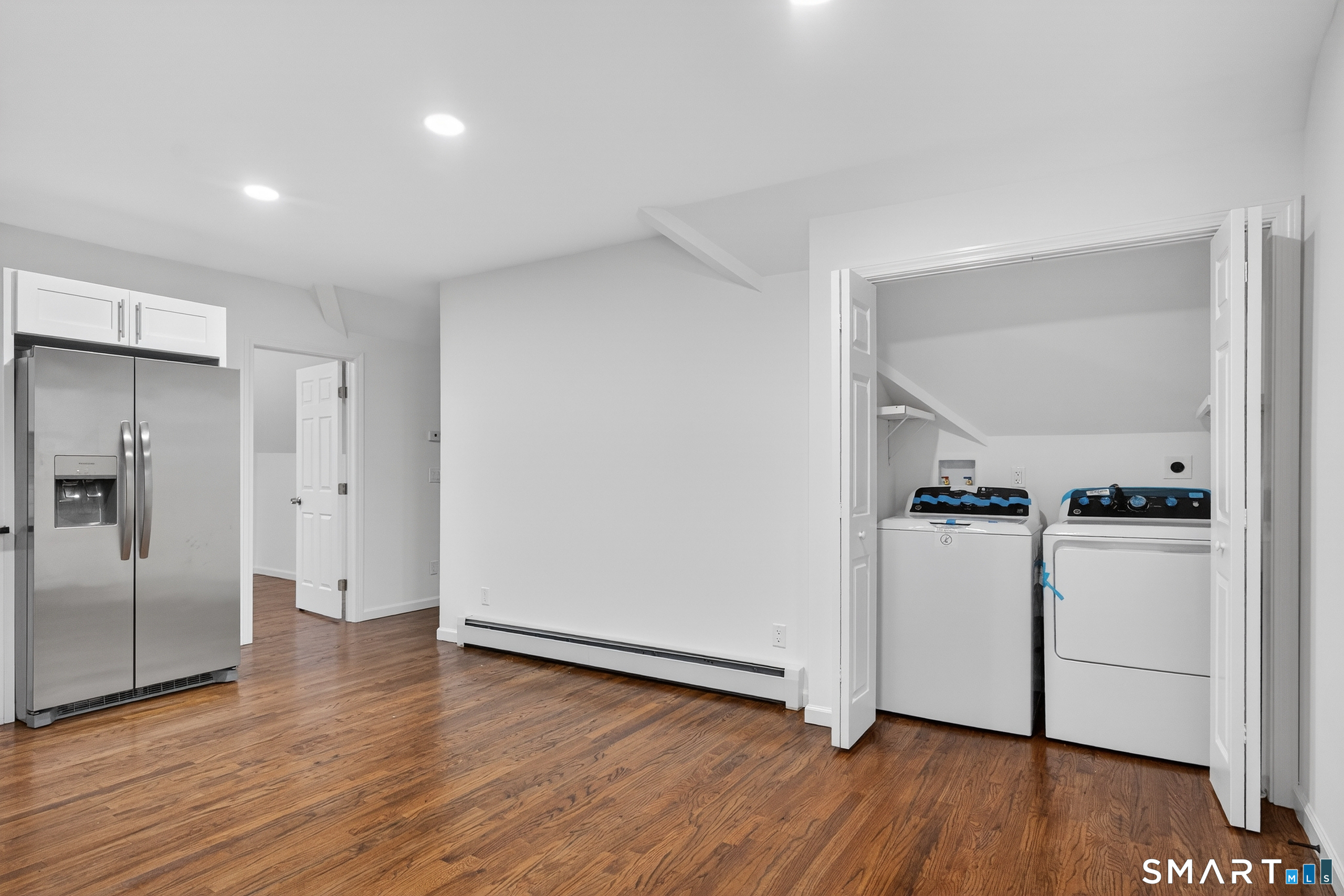 144 Cottage Street, Unit 3 Bridgeport, CT 06605 - Photo 8 of 12 a view of a hallway with wooden floor