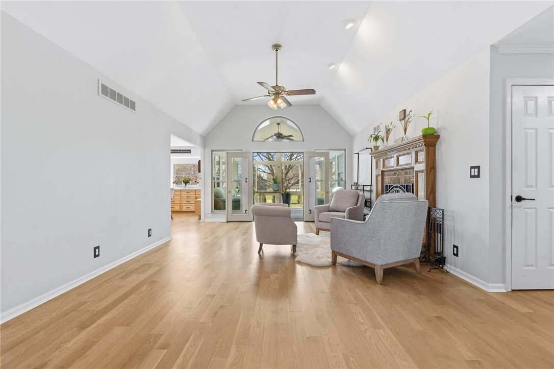 8781 Rupp Farm Drive West Chester, OH 45069 - Photo 6 of 48 This living room features vaulted ceilings, hardwood floors, and French doors leading to outdoor space.