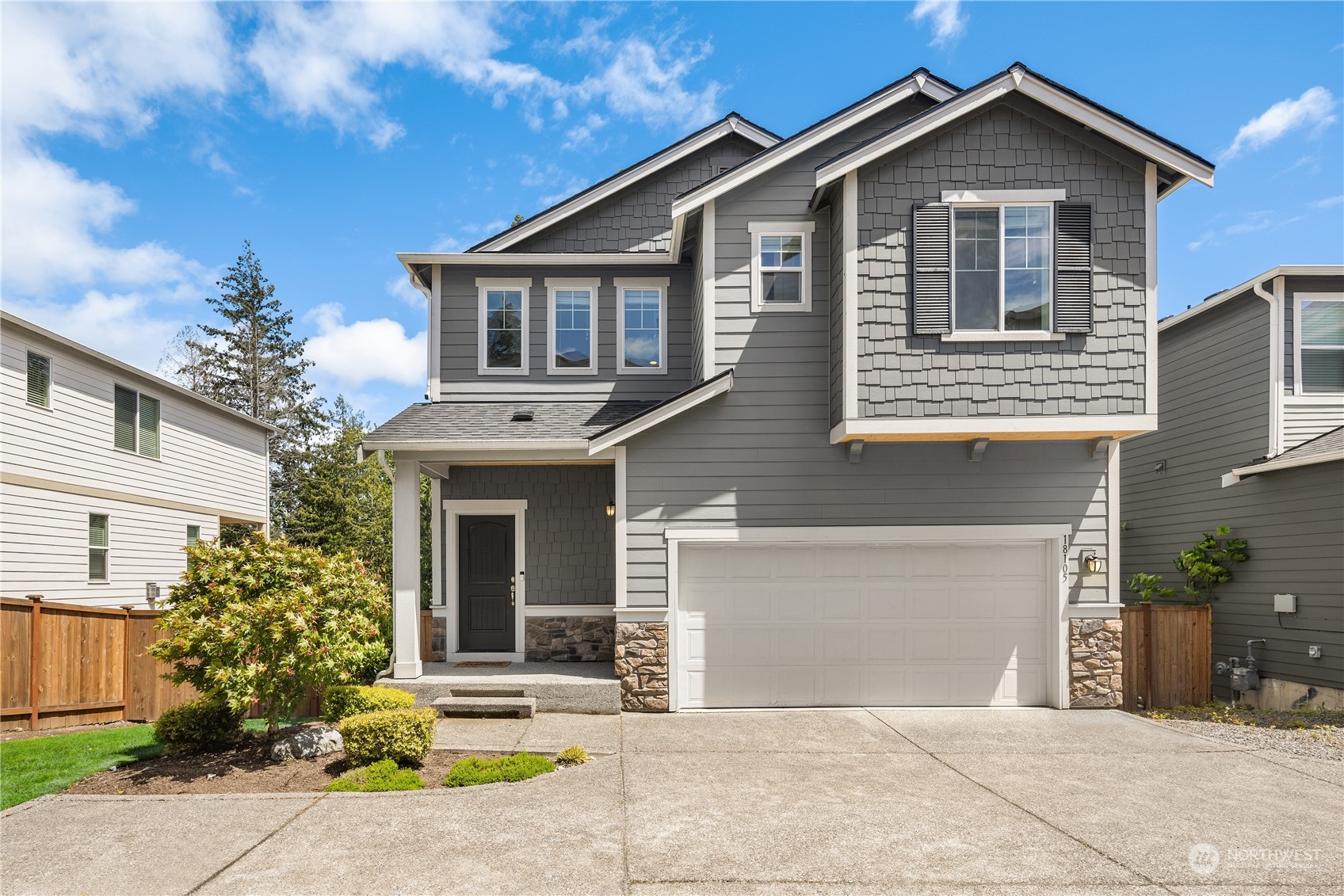 18105 3rd Drive Southeast Bothell, WA 98012 - Photo 1 of 28 a front view of a house with a yard and garage