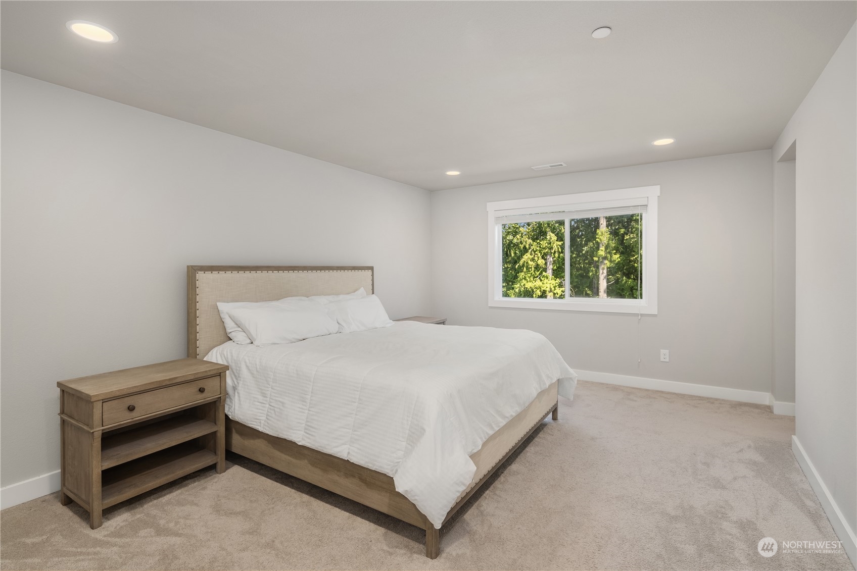 18105 3rd Drive Southeast Bothell, WA 98012 - Photo 12 of 28 a bed sitting in a bedroom next to a window