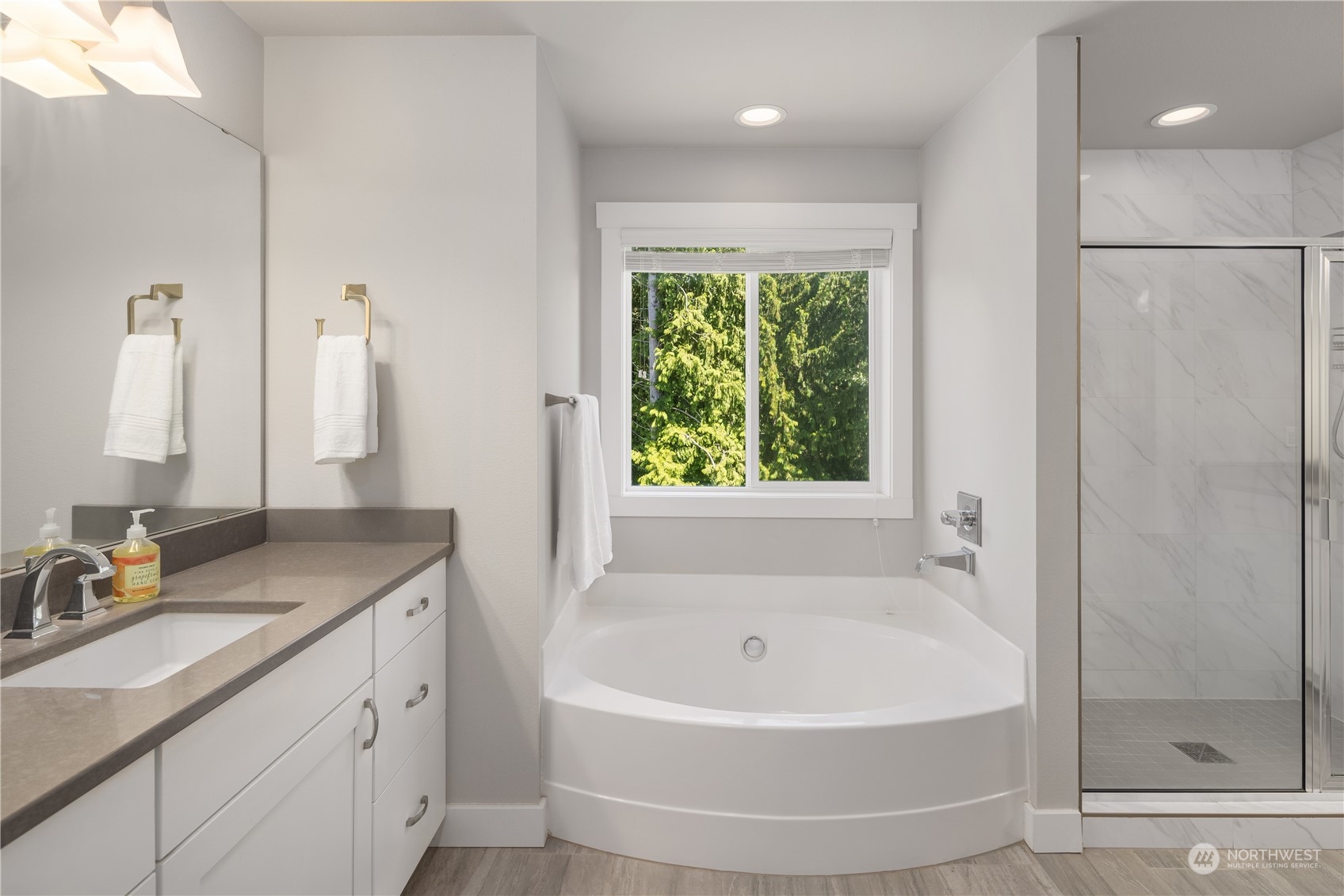 18105 3rd Drive Southeast Bothell, WA 98012 - Photo 13 of 28 a bathroom with a tub sink and mirror