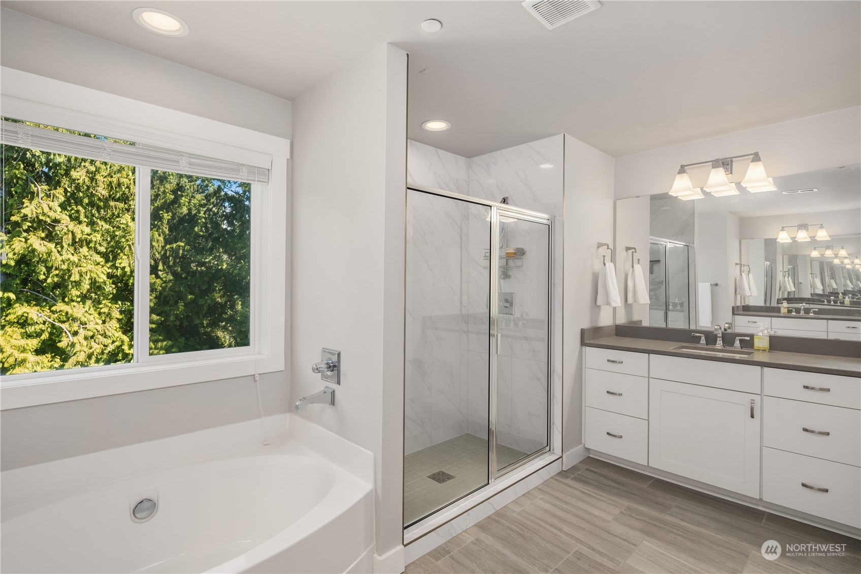 18105 3rd Drive Southeast Bothell, WA 98012 - Photo 14 of 28 a bathroom with a shower a sink and a large mirror