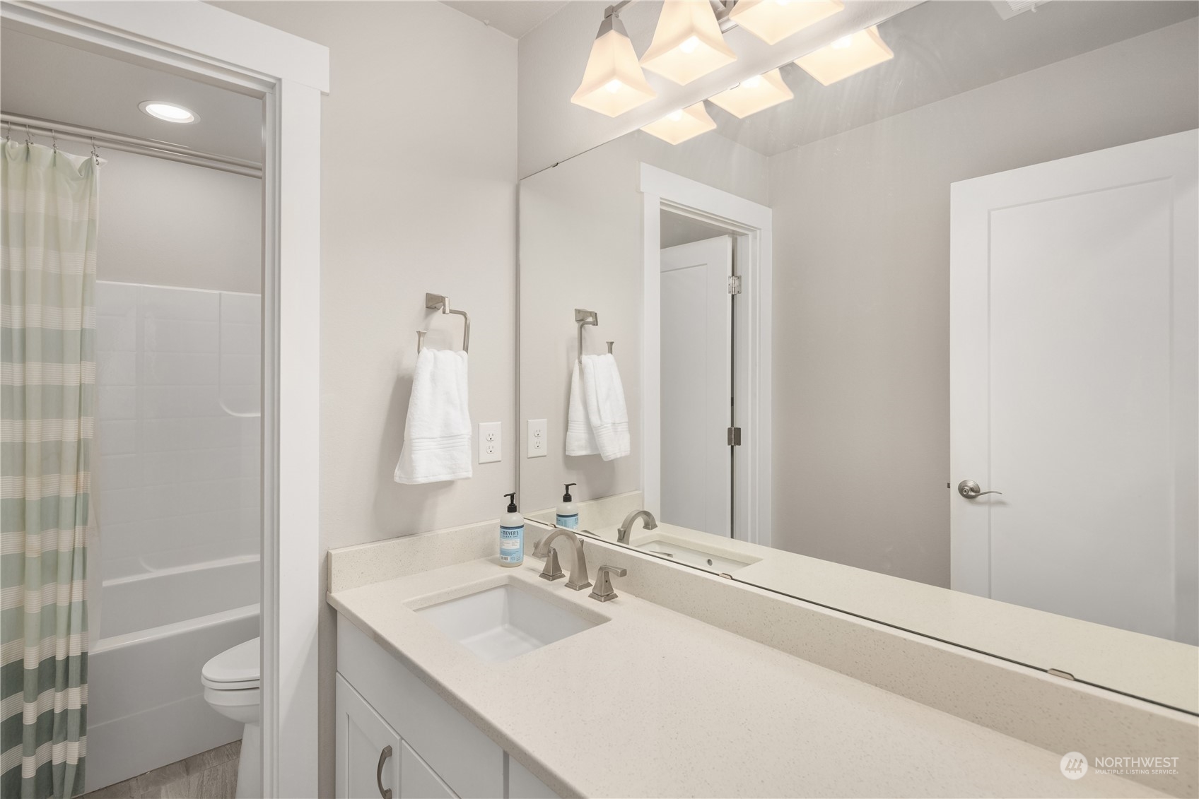 18105 3rd Drive Southeast Bothell, WA 98012 - Photo 17 of 28 a bathroom with a sink a toilet and a mirror