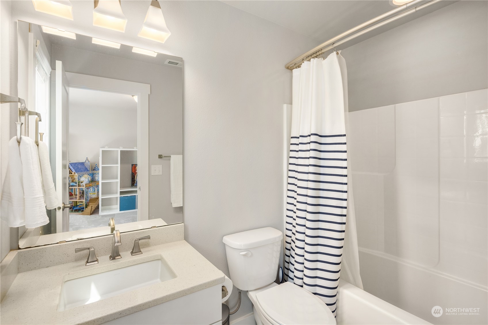 18105 3rd Drive Southeast Bothell, WA 98012 - Photo 20 of 28 a bathroom with a sink a toilet and shower curtain