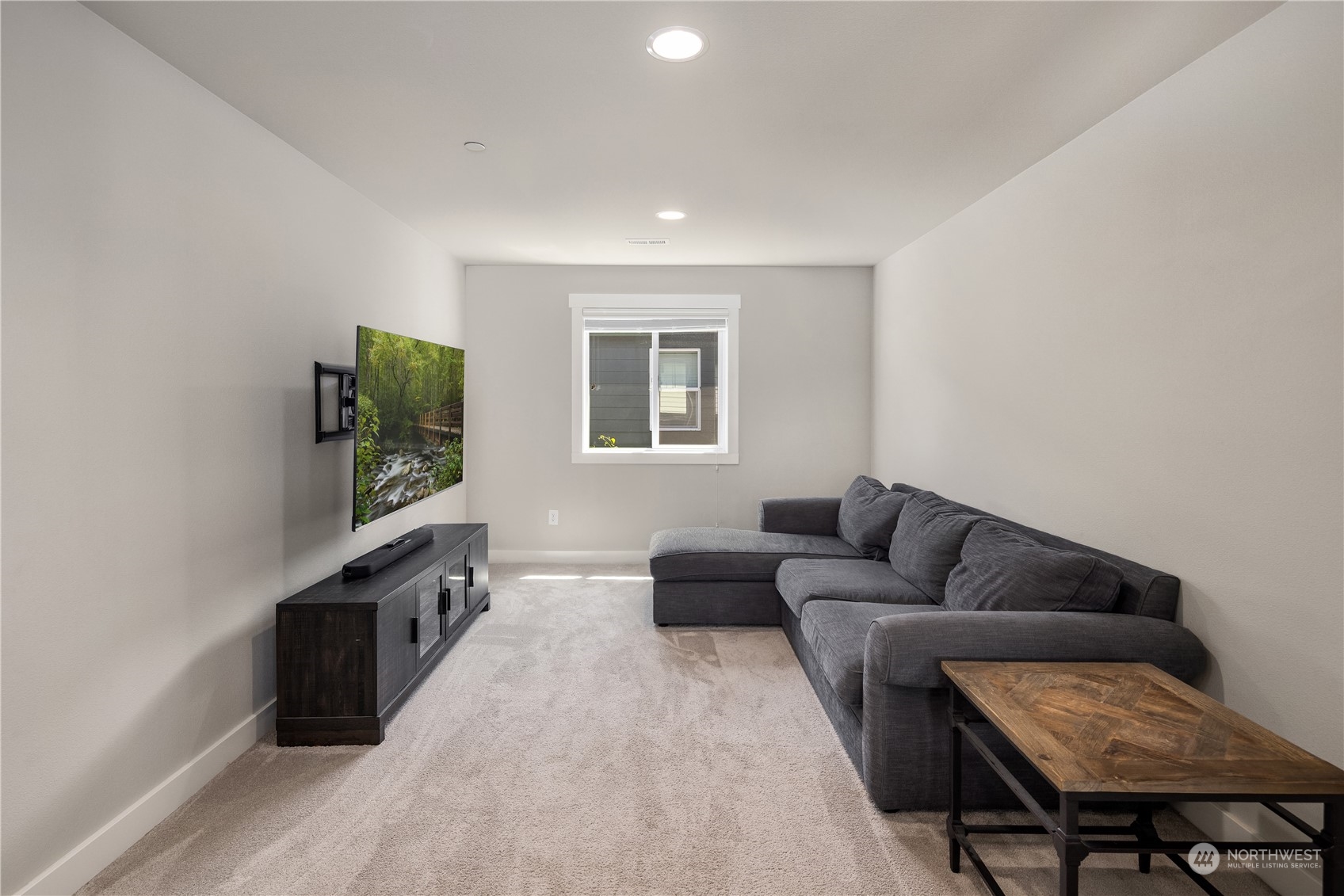 18105 3rd Drive Southeast Bothell, WA 98012 - Photo 21 of 28 a living room with furniture and a flat screen tv