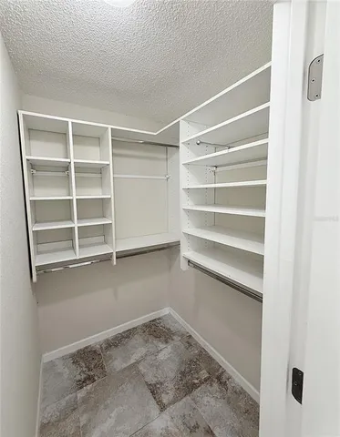 a view of a livingroom with wooden floor and windows