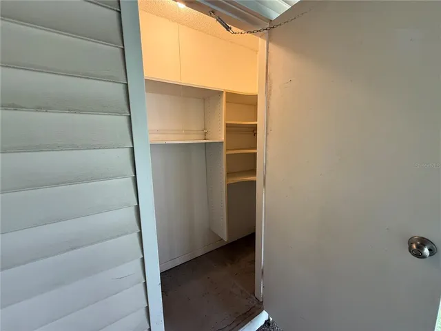 a view of a house with palm trees