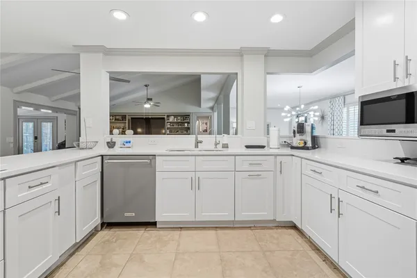 a spacious bathroom with a sink mirror and toilet