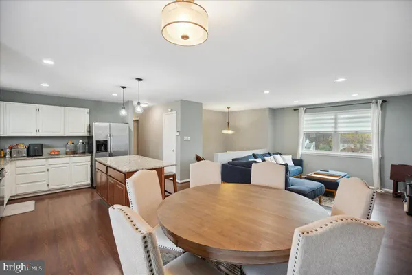 a large kitchen with a table and chairs