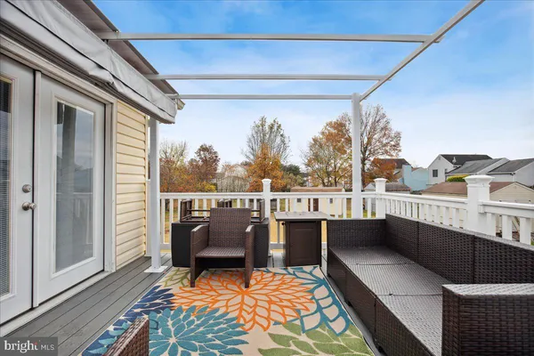 a balcony with furniture and a rug
