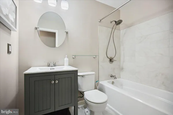 a bathroom with a sink toilet and a bathtub