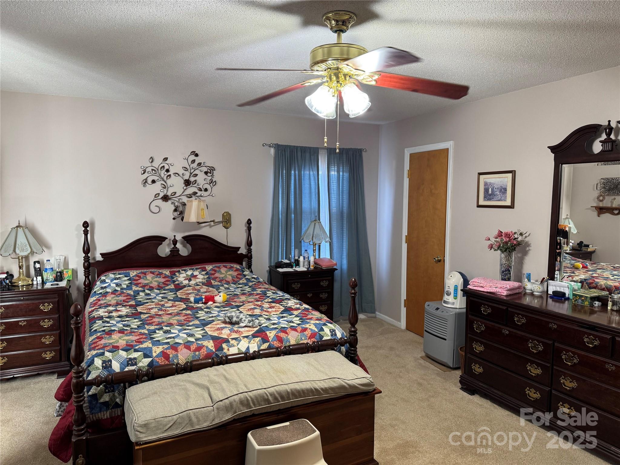 1068 Princeton Road Rock Hill, SC 29730 - Photo 12 of 25 a bedroom with a bed and a chandelier