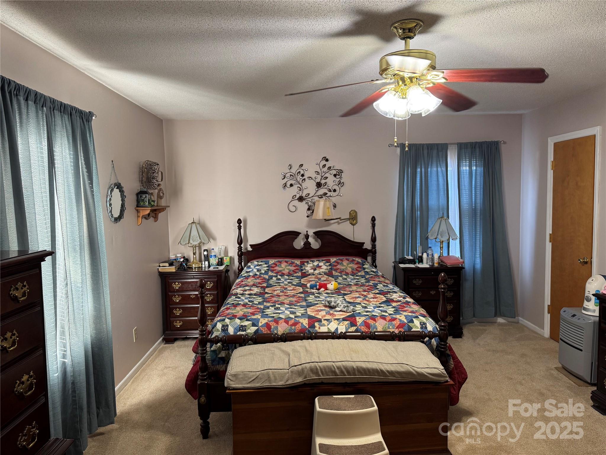 1068 Princeton Road Rock Hill, SC 29730 - Photo 14 of 25 a bedroom with a bed and a chandelier