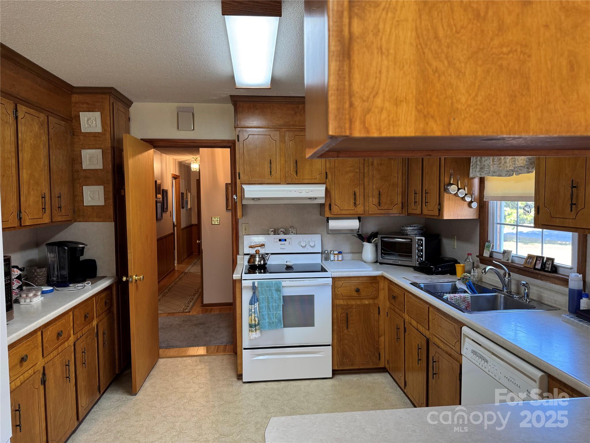 1068 Princeton Road Rock Hill, SC 29730 - Photo 7 of 25 a kitchen with a stove a sink and a refrigerator
