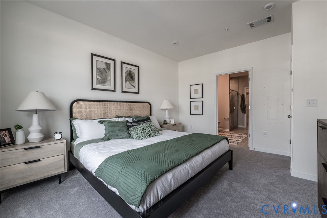 3727 Maze Runner Drive Midlothian, VA 23112 - Photo 20 of 42 a bedroom with a bed and a lamp