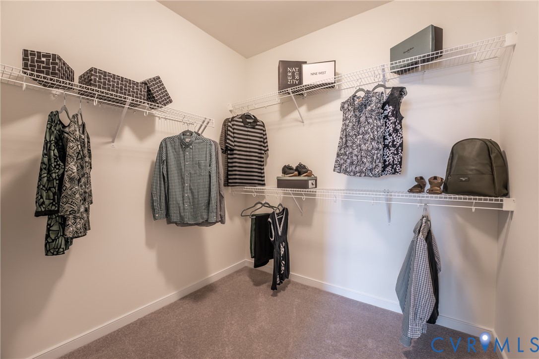3727 Maze Runner Drive Midlothian, VA 23112 - Photo 24 of 42 a view of walk in closet with clothes and shoes