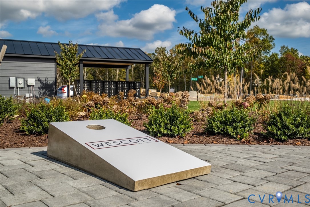 3727 Maze Runner Drive Midlothian, VA 23112 - Photo 41 of 42 a view of a white building with a big yard and large tree