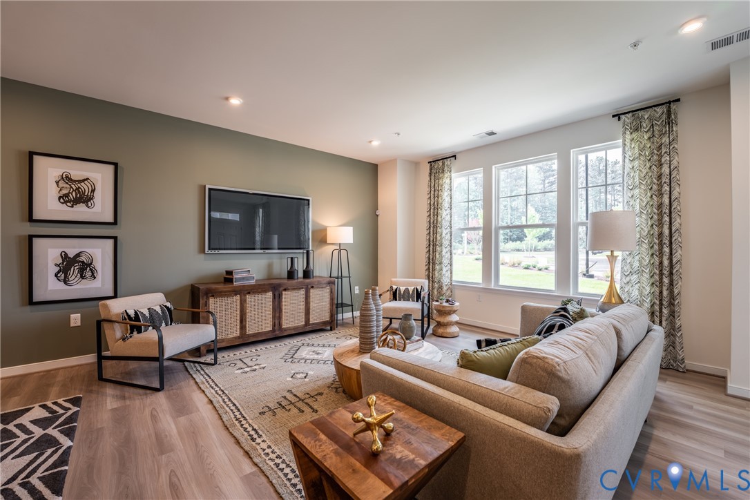 3727 Maze Runner Drive Midlothian, VA 23112 - Photo 7 of 42 a living room with furniture and a large window