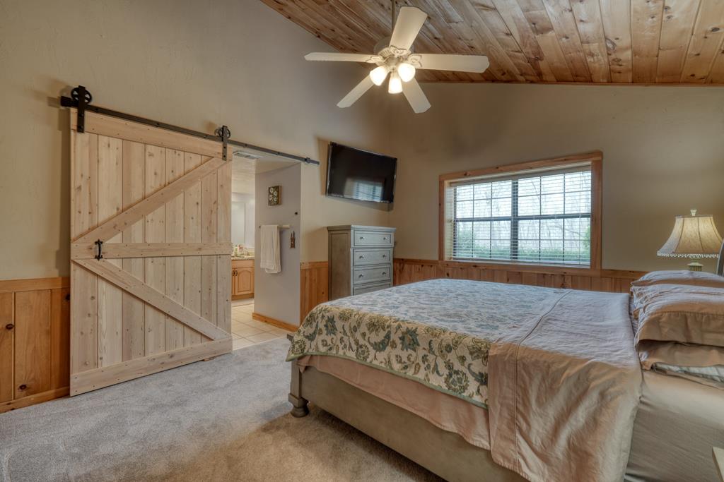 71 Andy Court Morganton, GA 30560 - Photo 12 of 43 a bedroom with a bed and a flat screen tv