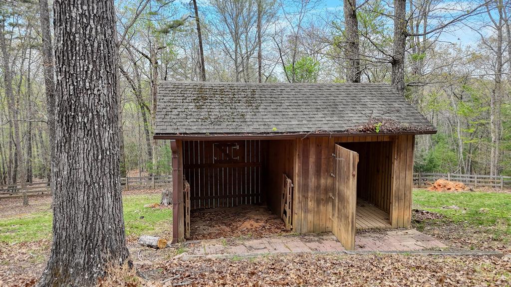 71 Andy Court Morganton, GA 30560 - Photo 31 of 43 a view of a wooden house with a large tree