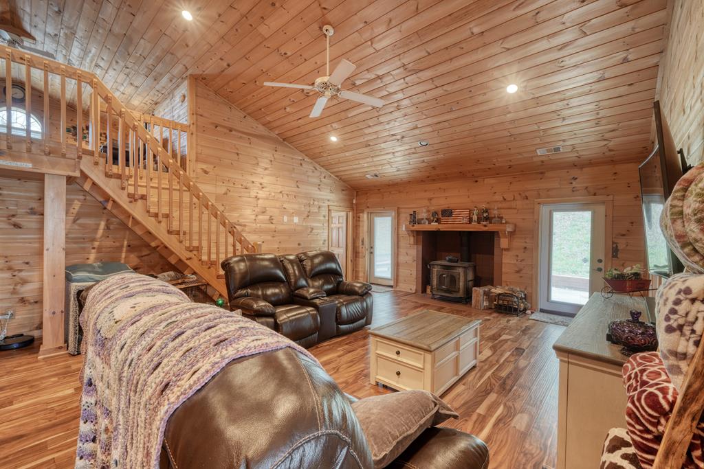 71 Andy Court Morganton, GA 30560 - Photo 5 of 43 a living room with furniture a fireplace and a table