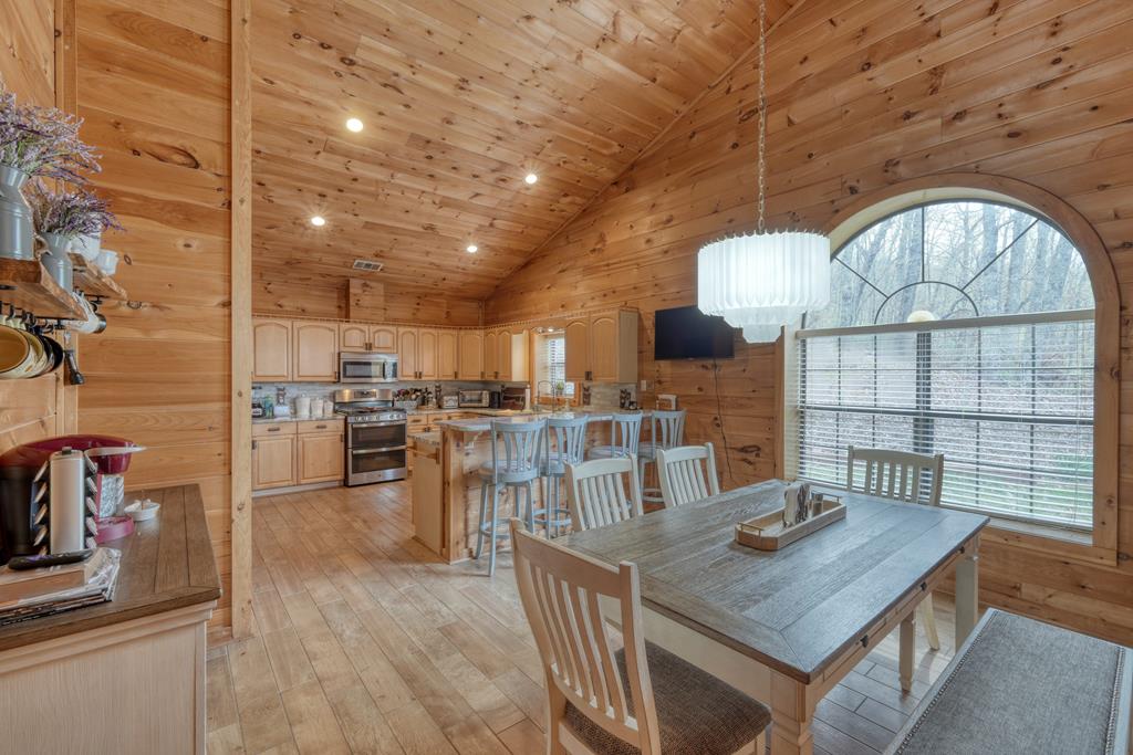71 Andy Court Morganton, GA 30560 - Photo 6 of 43 a view of a dining room with furniture a chandelier and wooden floor