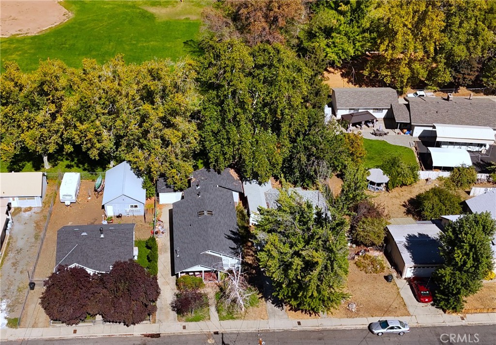 an aerial view of multiple houses with yard