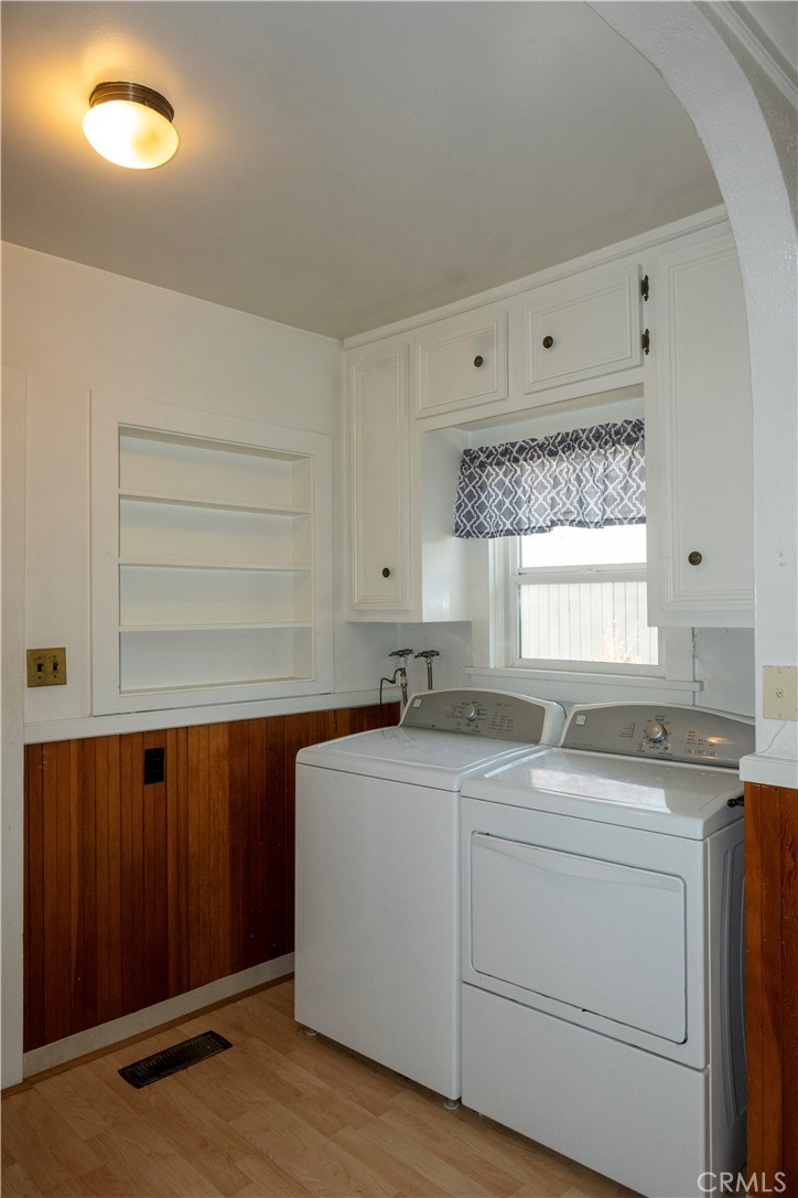 614 Lane Yreka, CA 96097 - Photo 12 of 39 a utility room with cabinets washer and dryer