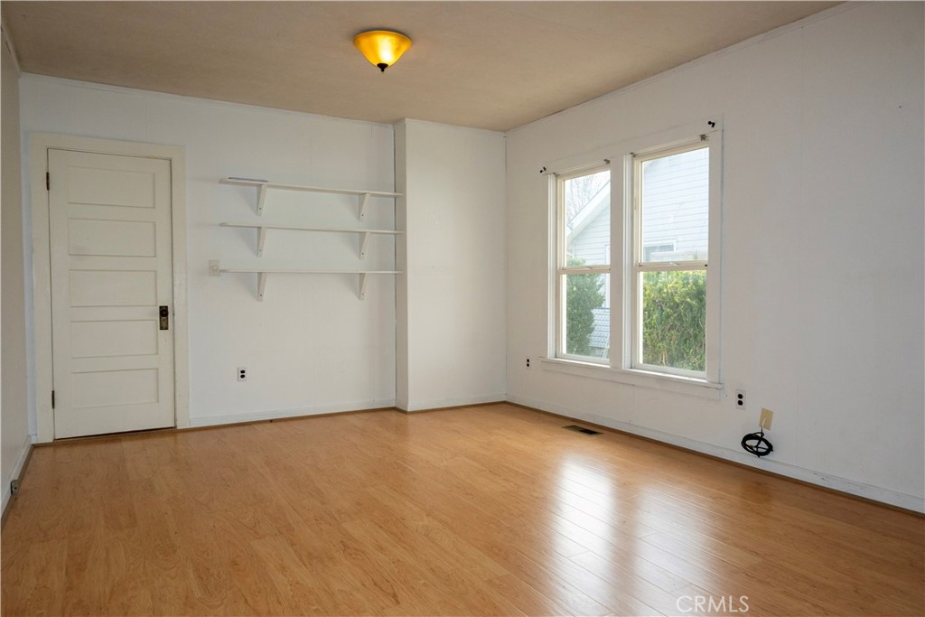 614 Lane Yreka, CA 96097 - Photo 18 of 39 an empty room with wooden floor and windows