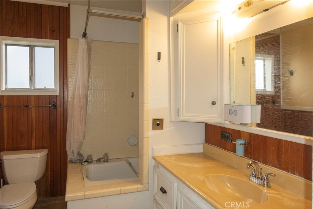614 Lane Yreka, CA 96097 - Photo 19 of 39 a bathroom with a granite countertop sink toilet and shower