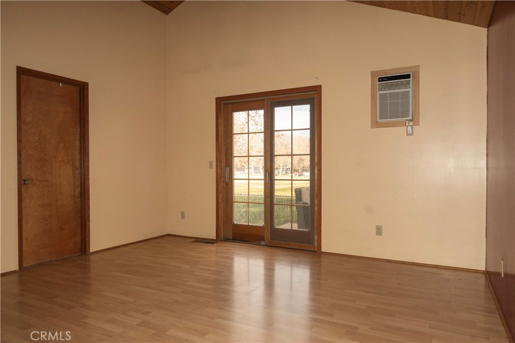 614 Lane Yreka, CA 96097 - Photo 23 of 39 an empty room with wooden floor and windows