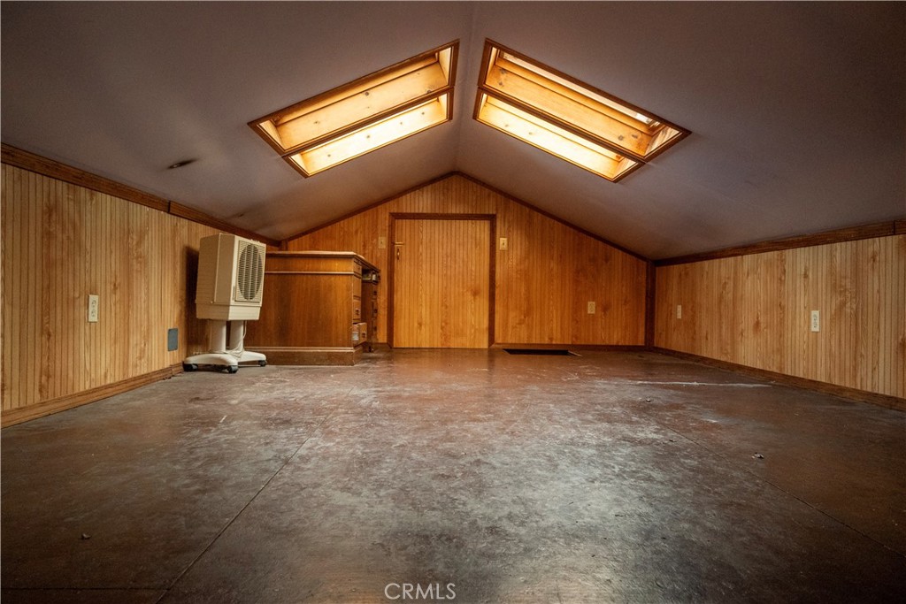 614 Lane Yreka, CA 96097 - Photo 28 of 39 a view of an empty room with a fireplace and wooden floor