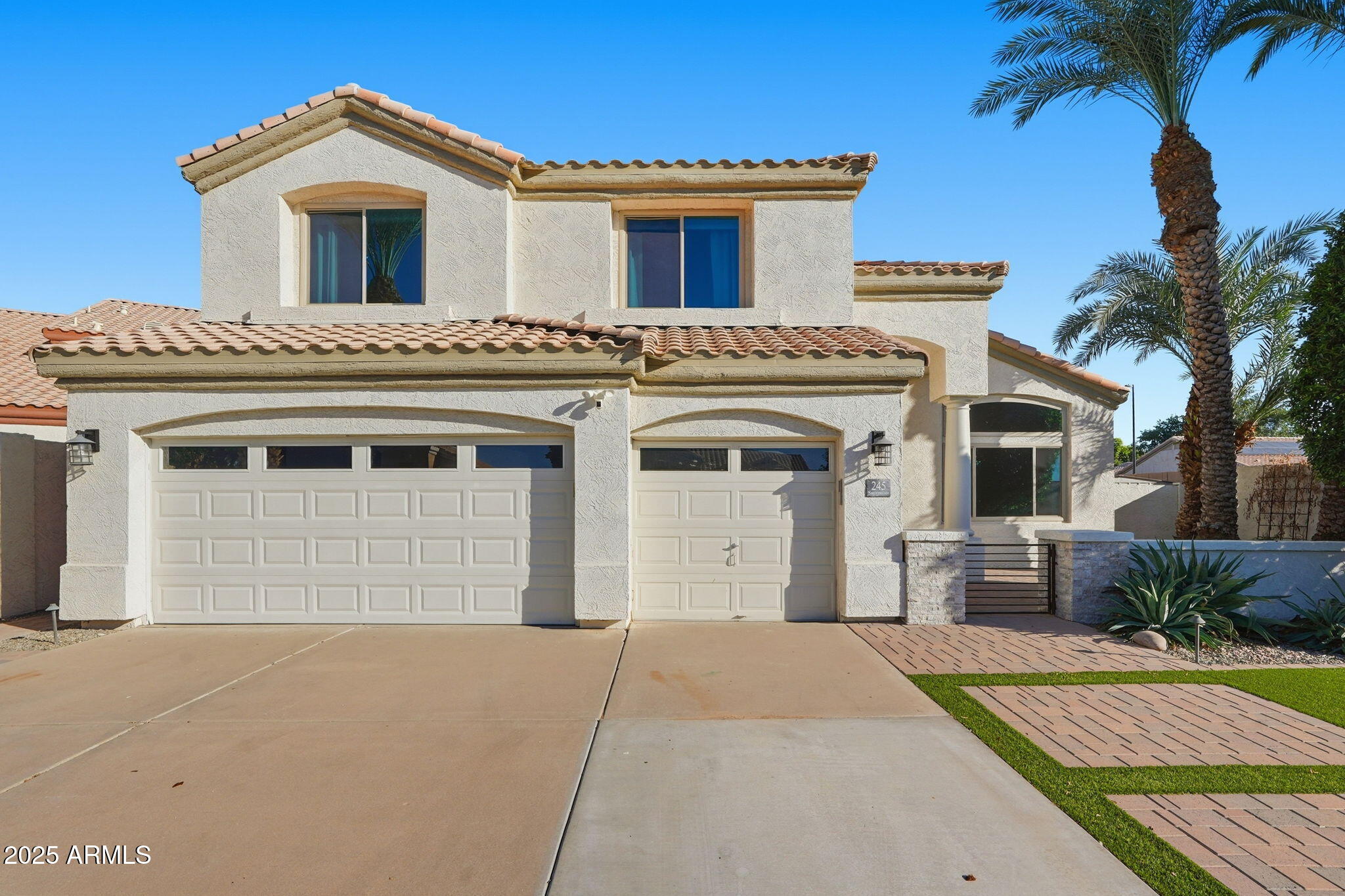 245 West Sagebrush Street Gilbert, AZ 85233 - Photo 3 of 62 a front view of a house with a garage