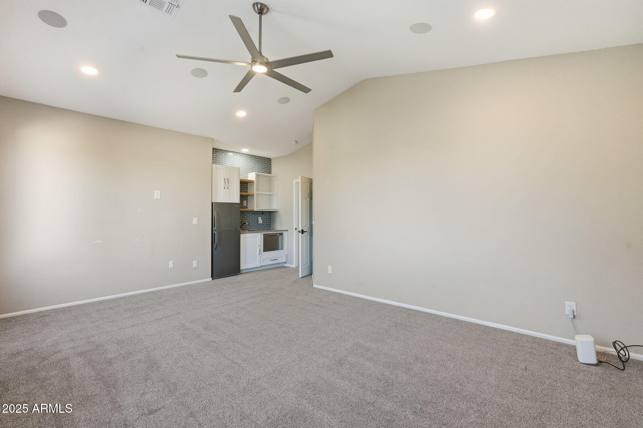 245 West Sagebrush Street Gilbert, AZ 85233 - Photo 31 of 62 an empty room with cabinet and a ceiling fan